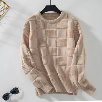 Chunky knit textured beige sweater for women displayed on a clothes hanger, featuring long sleeves and a cozy collar, perfect for autumn fashion.