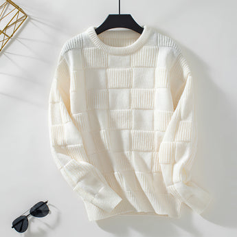 Chunky knit textured beige sweater with long sleeves and a round collar, displayed on a clothes hanger against a light background.