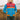 Color-block puffer jacket in luminescence blue, featuring a high collar and insulated design, shown in size 3XL. The jacket is styled with azure accents on the shoulders and sleeves, emphasizing its outerwear functionality and travel-ready appeal.
