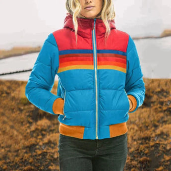 Color-block puffer jacket in luminescence blue, featuring a high collar and insulated design, shown in size 3XL. The jacket is styled with azure accents on the shoulders and sleeves, emphasizing its outerwear functionality and travel-ready appeal.