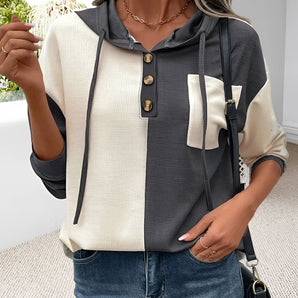 Color-block women's button-up hoodie in black and white, featuring a casual autumn fashion style with long sleeves and a comfortable fit, suitable for cool weather.