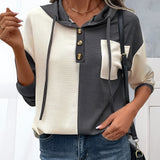 Color-block women's button-up hoodie featuring a black and white design, showcasing casual autumn fashion with a stylish shoulder and neck cut, suitable as outerwear for a trendy look.