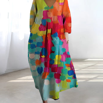 Colorful Bohemian Maxi Dress featuring an abstract print with a V-neckline, designed for summer wear, showcasing a one-piece garment with sleeves and a defined waist.