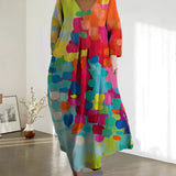 Colorful Bohemian Maxi Dress with an abstract print, featuring a V-neckline and magenta hues, designed as a one-piece garment for summer wear. The dress includes details like a defined waist, short sleeves, and is styled for a day out.
