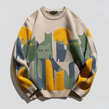A cozy, beige crewneck sweater featuring a colorful artistic cat print design, displayed in a size 2XL with long sleeves.