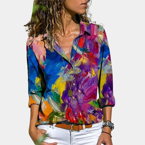 Purple floral blouse for women in XL size, featuring a vibrant summer design with a collar, sleeves, and fitted waist.