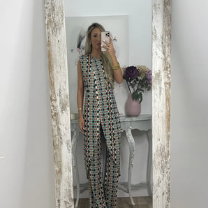 Colorful geometric boho jumpsuit with a sleeveless wide-leg design in a blue lake color, featuring an intricate pattern.