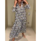 Colorful geometric long sleeve V-neck midi dress in a casual boho style, featuring a fitted waist and flowing sleeves.