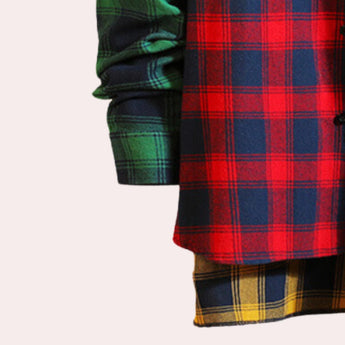 A men's plaid shirt featuring a colorful checkered pattern with electric blue and magenta hues, long sleeves, and a classic collar design.