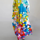Colorful polka dot long sleeve maxi dress with a vibrant abstract print featuring multicolor patterns, including electric blue, designed for a stylish and trendy look.