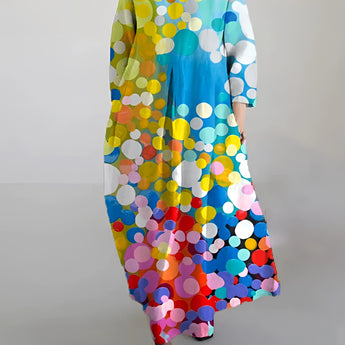 Colorful polka dot long sleeve maxi dress with a vibrant abstract print featuring multicolor patterns, including electric blue, designed for a stylish and trendy look.
