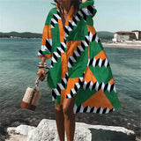 Colorful Retro Print Kaftan in green, 5XL size, featuring a vibrant psychedelic pattern, shown as a beach cover-up with flowing sleeves perfect for summer travel, set against a backdrop of a lake and sky.