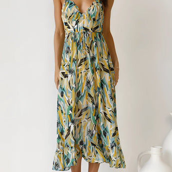 Colorful tropical print maxi dress in green, sleeveless design, suitable for summer beachwear, shown in size XL, highlighting the dress's vibrant pattern, flowing silhouette, and comfortable fit.