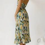Colorful tropical print maxi dress featuring a sleeveless design ideal for summer beachwear.