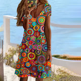 Colorful V-neck summer dress with geometric mandala print, knee-length beachwear, multicolored, size 3XL, displayed on a model.