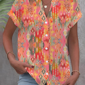 Women's colorful V-neck tribal print bohemian blouse with short sleeves and vibrant orange patterns, perfect for summer.