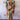 Colorful wave pattern knee-length summer dress in multicolor with a V-neck, featuring short sleeves and a fitted waist, modeled by a person.