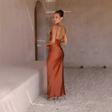 Copper satin one-shoulder evening gown displaying elegant formal wear, featuring a sleek, fitted silhouette with a single sleeve design, showcasing the neck and waistline.