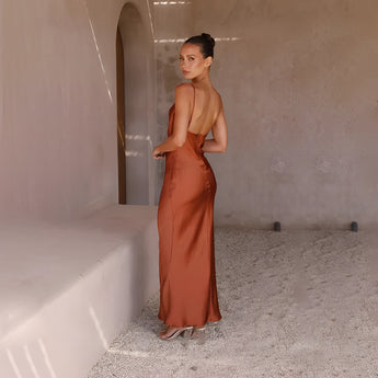 Copper satin one-shoulder evening gown displaying elegant formal wear, featuring a sleek, fitted silhouette with a single sleeve design, showcasing the neck and waistline.