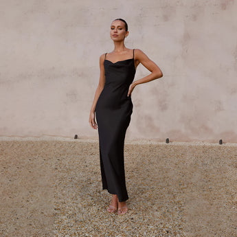 Copper satin one-shoulder evening gown showcasing elegant formal wear, highlighting the shoulder and waist with a flowing skirt.