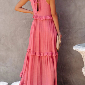 Coral backless halter maxi dress with tiered ruffle detailing, featuring a boho summer style and sleeveless design.