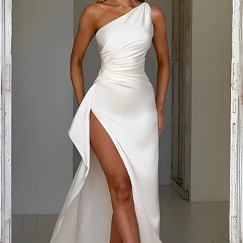 Ivory cowl neck backless satin evening dress in size 2XL, featuring a flowing one-piece design with a focus on elegance and formal wear. Model showcases hairstyle complementing the neckline, emphasizing the dress's sleek silhouette and sophisticated appearance.
