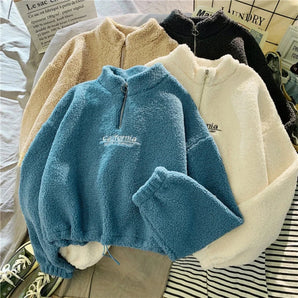 Cozy Teddy Fleece Half-Zip Pullover in warm blue featuring a soft sherpa material with a half-zip design, long sleeves, and a comfortable collar.