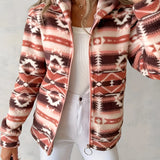 Woman wearing a cozy Southwestern-style plush fleece zip-up jacket in an outdoor setting. The jacket features a soft fleece material and distinctive Southwestern patterns, providing warmth and comfort. The focus is on the upper body, highlighting the jacket's design and texture.