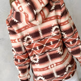 Cozy Women's Southwestern Plush Fleece Zip-Up Jacket featuring a soft fleece material with a stylish zip-up design, long sleeves, and a comfortable fit around the shoulders and neck.