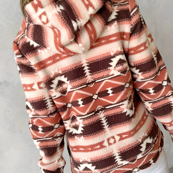 Cozy Women's Southwestern Plush Fleece Zip-Up Jacket featuring a soft fleece material with a stylish zip-up design, long sleeves, and a comfortable fit around the shoulders and neck.
