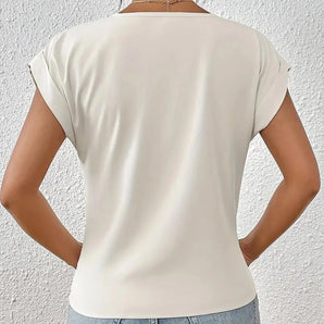 Cream blouse with elegant short sleeves, featuring a fashionable design suitable for work and casual settings, showcased on a mannequin.