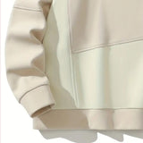 Unisex cream crewneck sweatshirt with long sleeves and a minimalist casual design, featuring a beige color and comfortable fit.