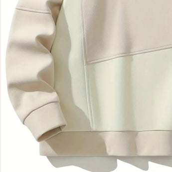 Unisex cream crewneck sweatshirt with long sleeves and a minimalist casual design, featuring a beige color and comfortable fit.