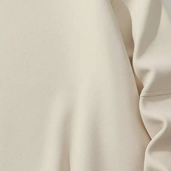 Cream crewneck sweatshirt with long sleeves, minimalist design suitable for casual wear, displayed on a mannequin or model.