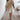 Cream floral high neck mini dress with balloon sleeves in white, featuring a chic spring style. The dress is designed with a fitted waist and elegant long sleeves, suitable for a 3XL size.