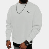 Cream Men's Crewneck Sweatshirt in Minimalistic Urban Style with Bird Logo, shown in a large 3XL size. The sweatshirt is worn by a person with a focus on the upper body, highlighting the white fabric, crewneck design, and long sleeves.