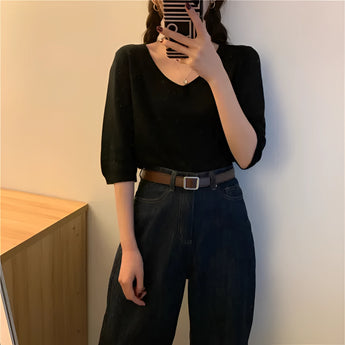 Cream three-quarter sleeve V-neck blouse, elegant business and casual top, shown in black, featuring comfortable fit and stylish design.