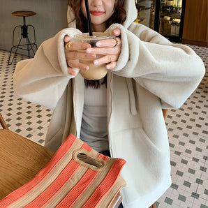 Cream Women's Plush Oversized Teddy Coat showcasing a cozy design with a soft beige texture, featuring a wide collar, long sleeves, and a comfortable fit ideal for winter fashion.