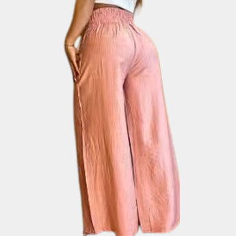 Crinkled long sleeve high-neck pink formal dress with a fitted waist and elegant design.