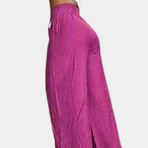Crinkled pink formal dress with long sleeves and a high neck, showcasing a fitted waist design.