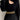 Black cutout ribbed knit sweater with puffed sleeves, featuring a trendy winter fashion style. The sweater has a high neckline and fitted waist, designed for a fashionable look. The image shows the sweater being worn, emphasizing its stylish design and comfortable fit.