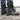 Delta Tactical Boots in sand color, designed for military combat and all-terrain hiking, shown being worn by a person standing outdoors on grass, wearing jeans.