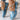 Blue denim ballet flats for women adorned with sparkling rhinestones and an elegant ankle chain.