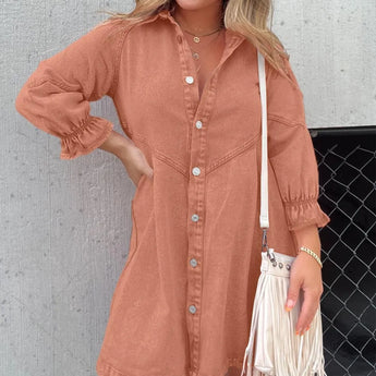 Orange oversized denim mini shirtdress with puffed sleeves and a belt, displayed on a mannequin.