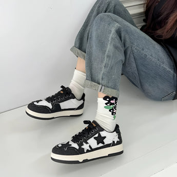 Denim and suede star design sneakers in Nero color, size 40, showcasing a trendy urban style with a grey tartan pattern, suitable for casual and sportswear, displayed on a human leg.