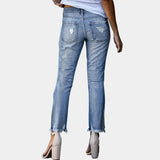 Light wash denim distressed ripped skinny jeans for women, featuring a modern fit and stylish details like distressed patches and a slim silhouette.