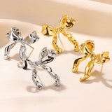 Gold earrings in intricate bound shapes design, featuring artistic metalwork and symbol-inspired elements, ideal as a fashionable accessory for events.