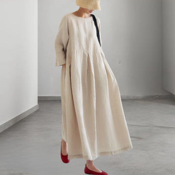 Eco-friendly oatmeal linen maxi dress featuring a minimalist loose fit design with long sleeves, tailored for casual day wear.
