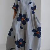 Eco-friendly oversized floral dress featuring a white and green leaf print design, shown in gray color, size 4XL, with short sleeves and a round neckline.