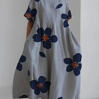Eco-friendly oversized floral dress featuring a white and green leaf print design, shown in gray color, size 4XL, with short sleeves and a round neckline.